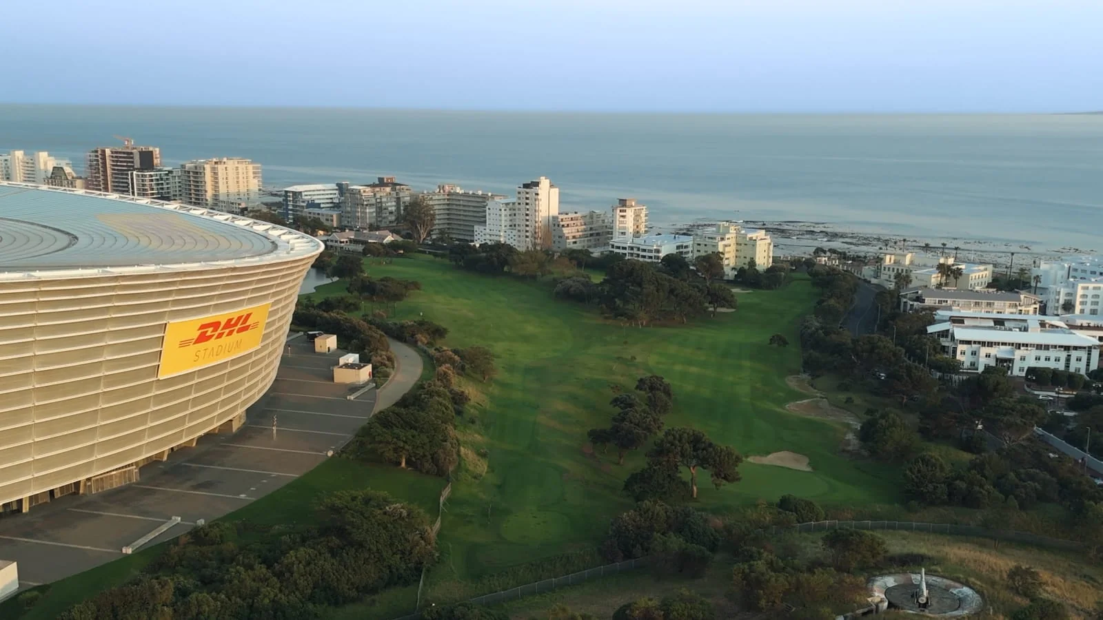 A fairway between the stadium and the sea
