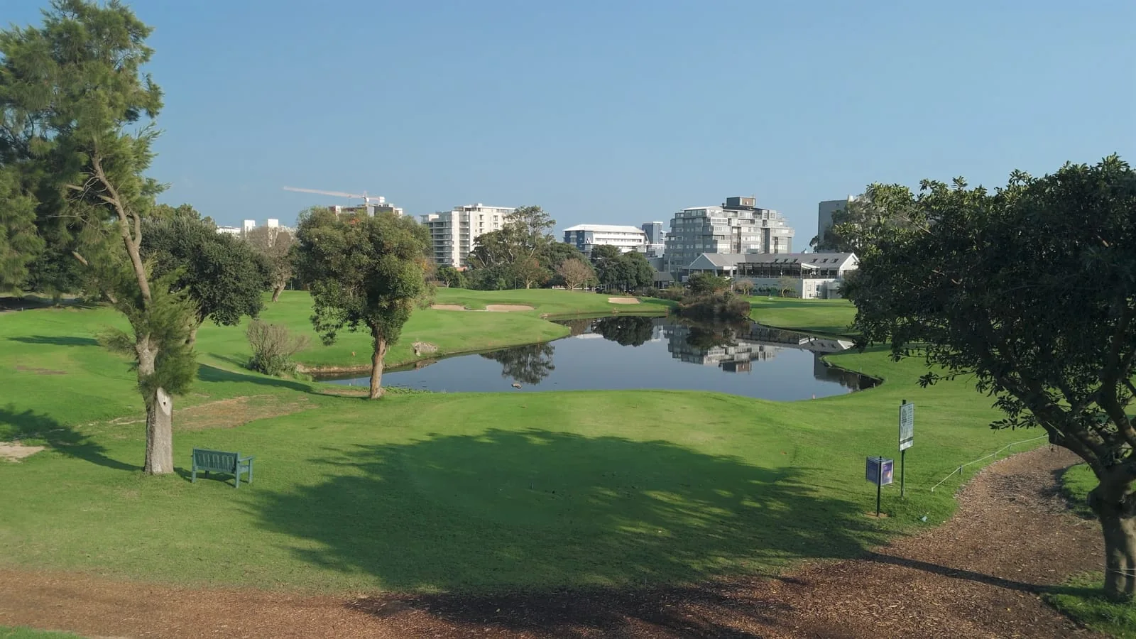 Across the water from a shaded tee