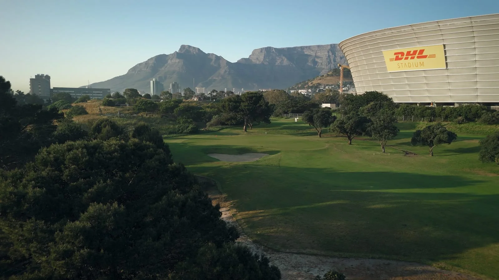 A fairway beside the stadium, with Devil's Peak and Table Mountain behind